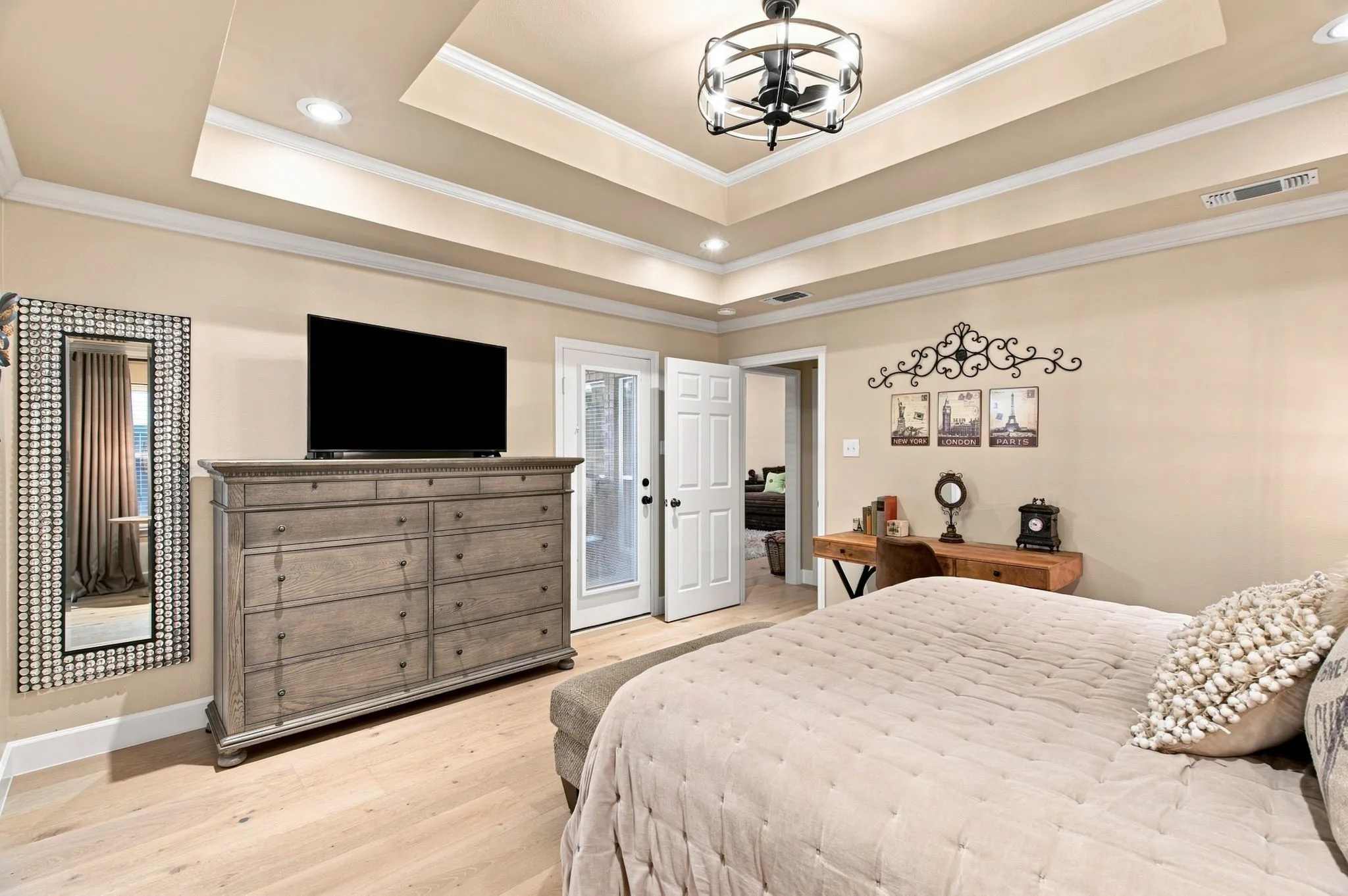 Tray ceiling with recessed lighting and crown molding