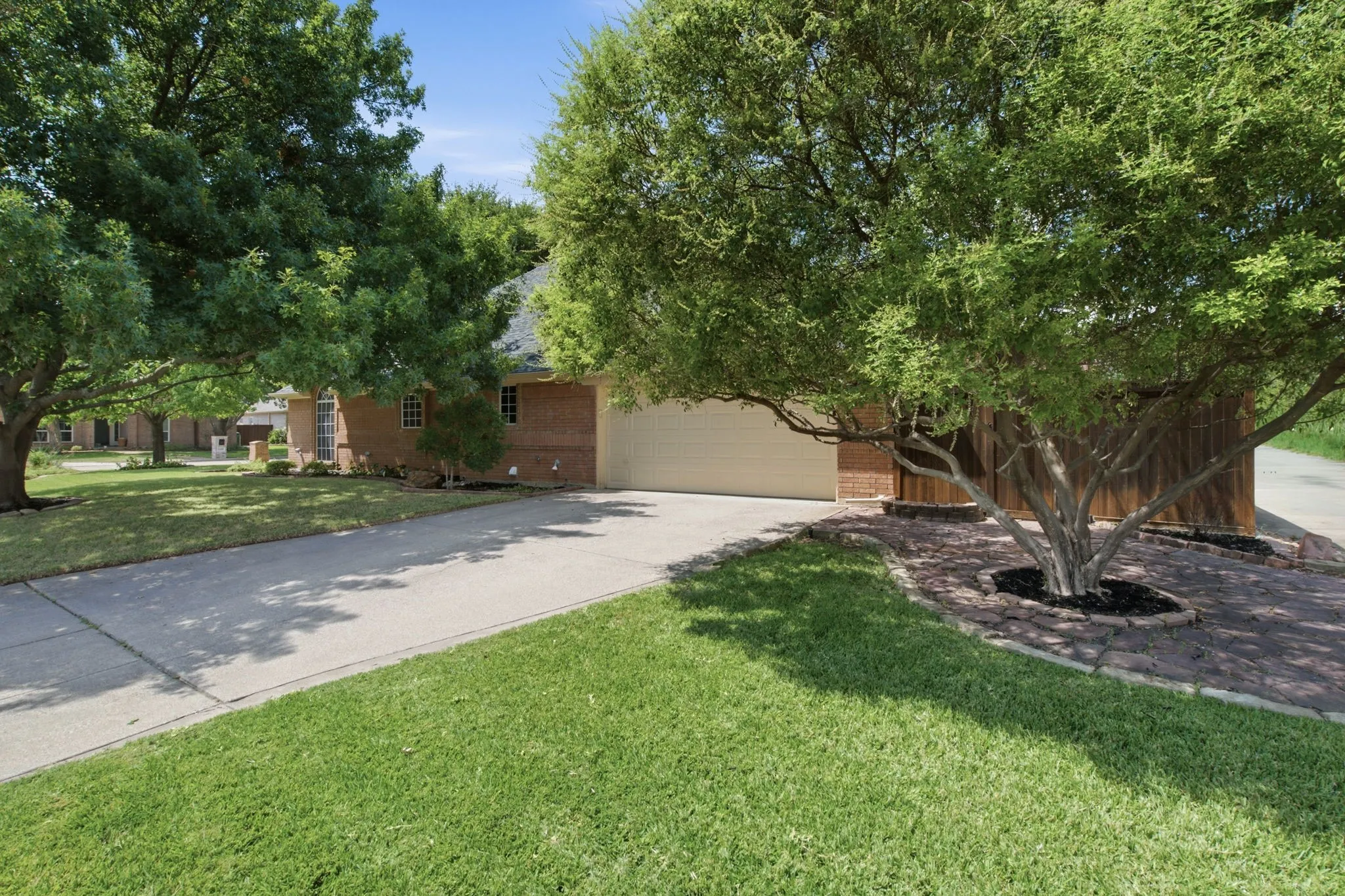 Brick exterior with a gabled roof and attached garage