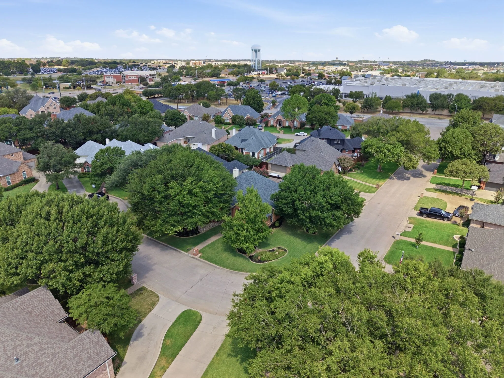 Residential neighborhood with mature trees and paved streets