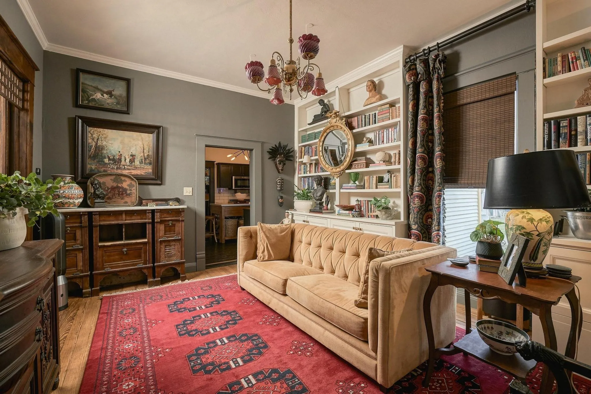 Modern color palette, abundant art and book display space and a direct lead-in to the kitchen.