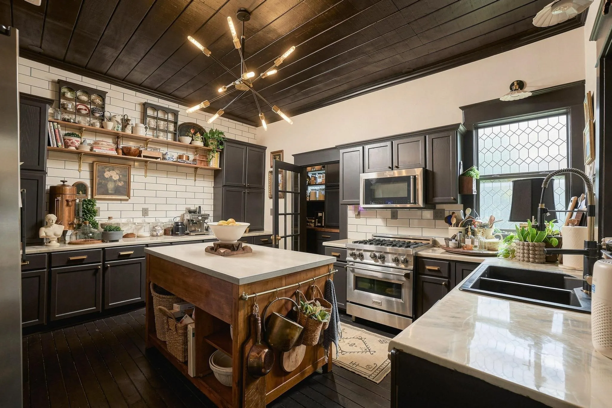 Pure wow factor-with premium appliances, a classic subway tile accent wall and period-correct brass hardware.