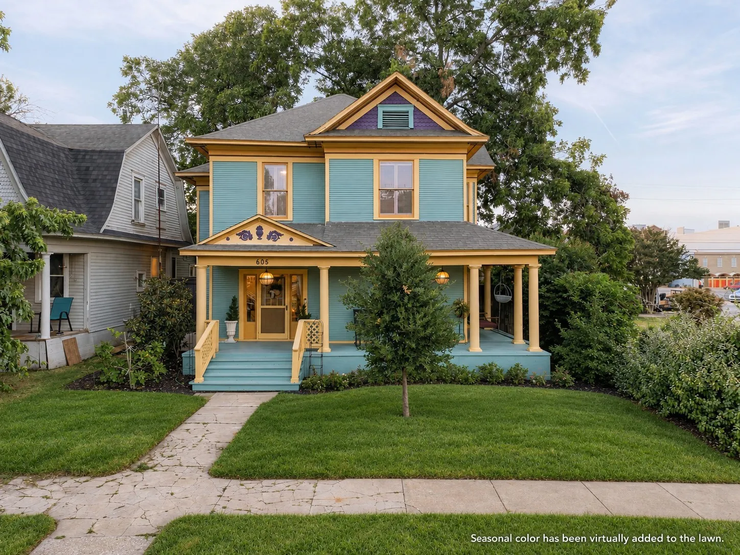 Max Curb Appeal with the Patterned Wooden Shingles in the Upper Gable and Vibrant Multi-Color Paint