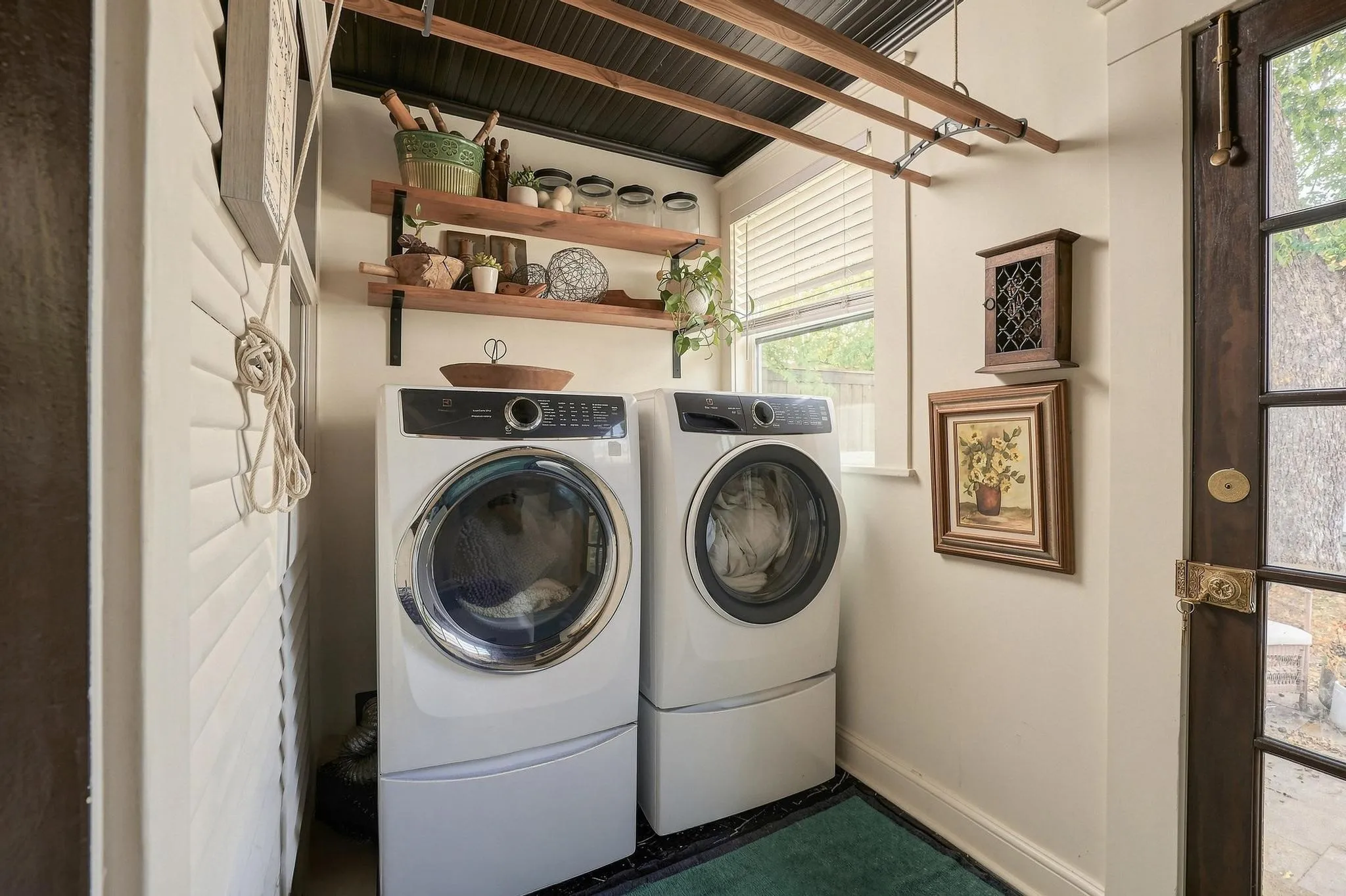 Original beadboard ceiling, premium front-load washer/dryer, a unique overhead drip-dry rack and beautiful door hardware.