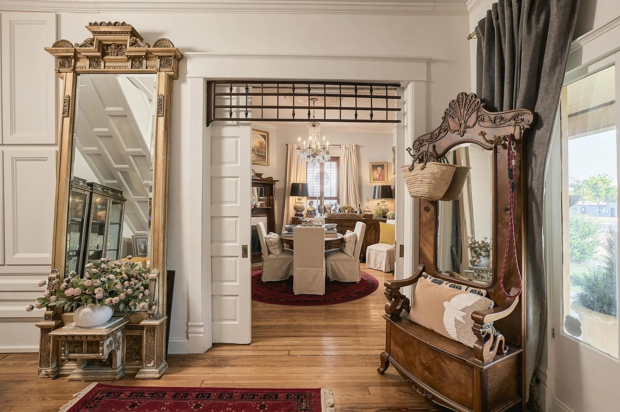 Floor to Ceiling Cabinets and Drawers Provide Storage Solutions. The Cased Opening with Original Pocket Doors is Adorned with Spindle Fretwork.