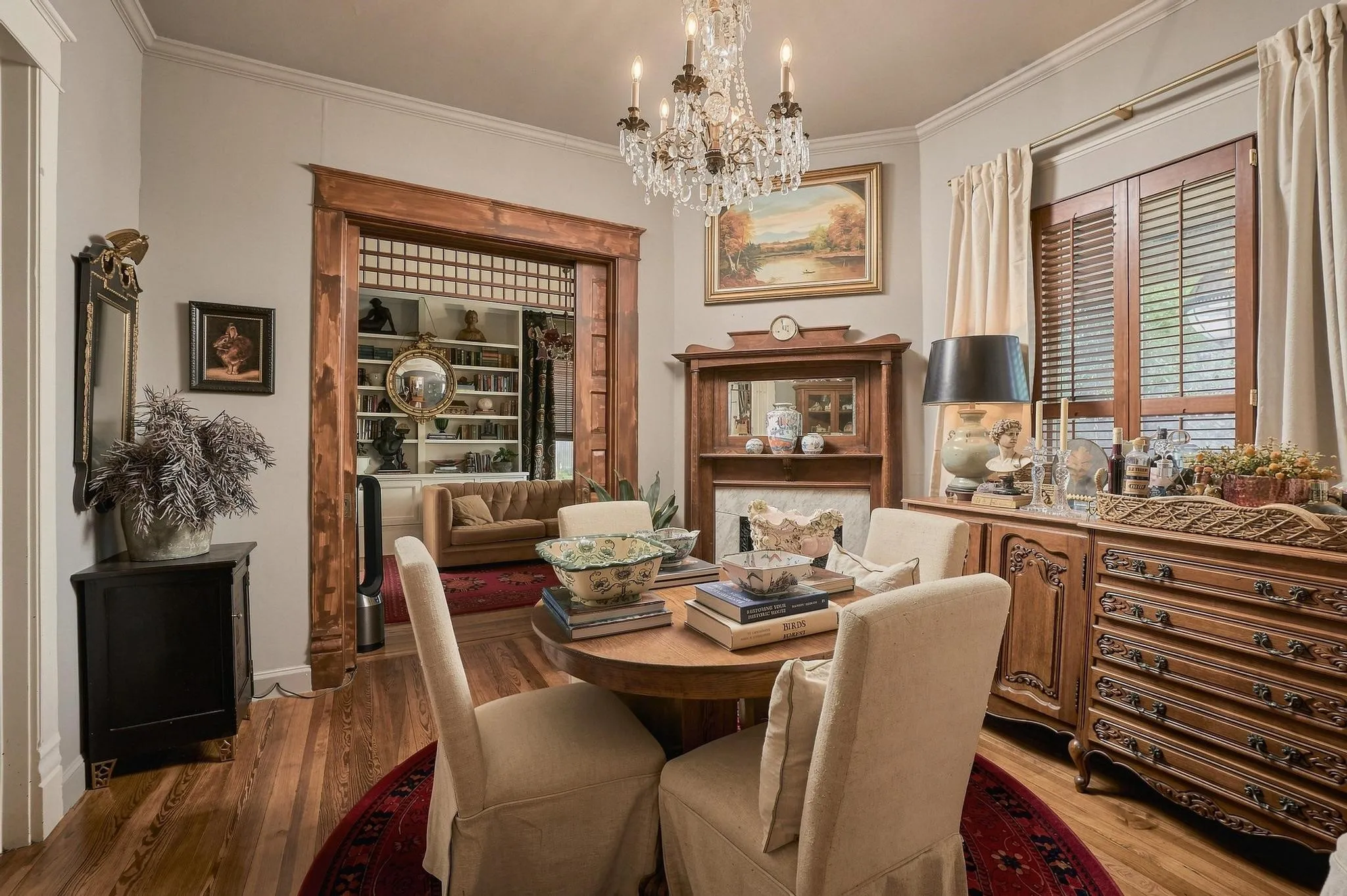 Originally "The Parlor", this Space Features a Stunning Crystal Chandelier and Massive Pocket Doors