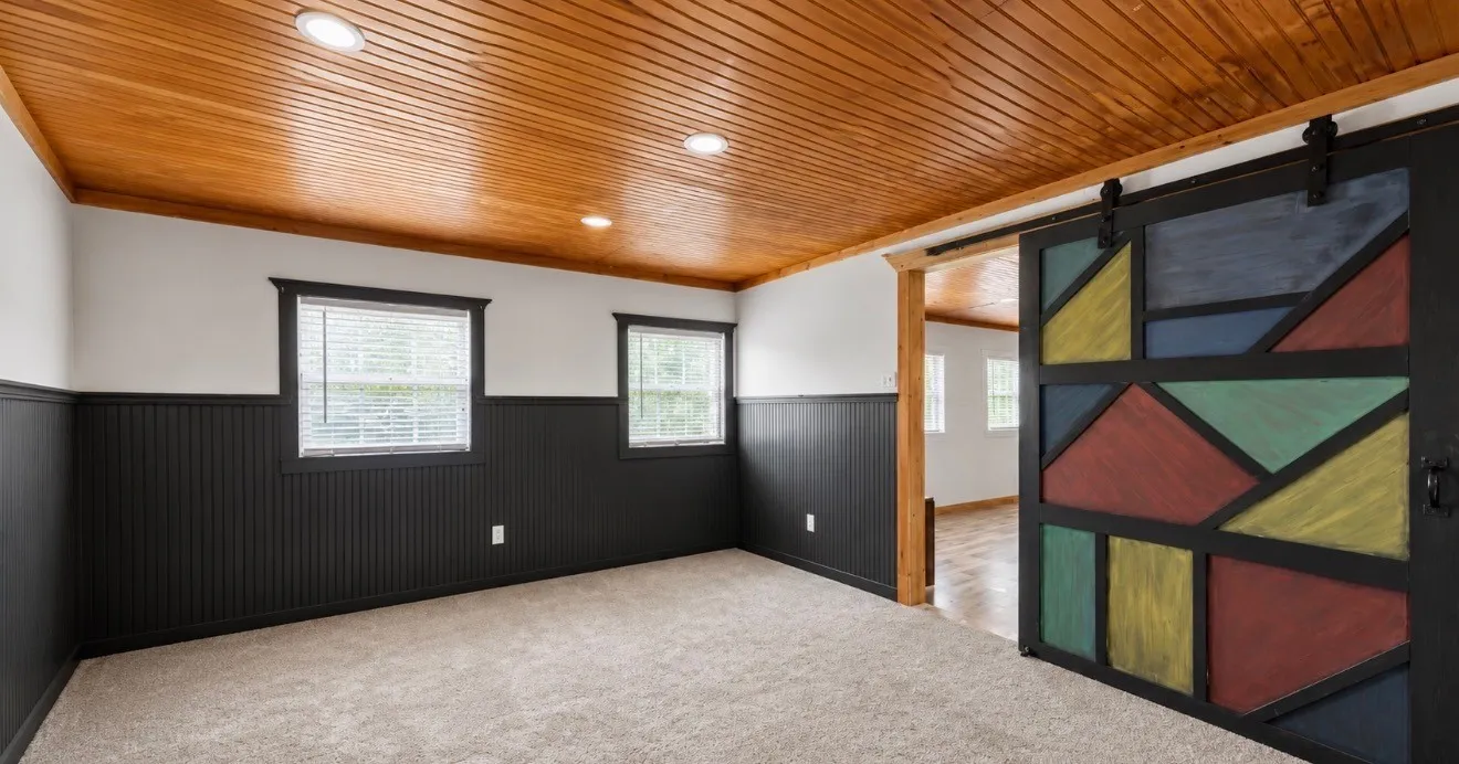 Wood-paneled ceiling with recessed lighting