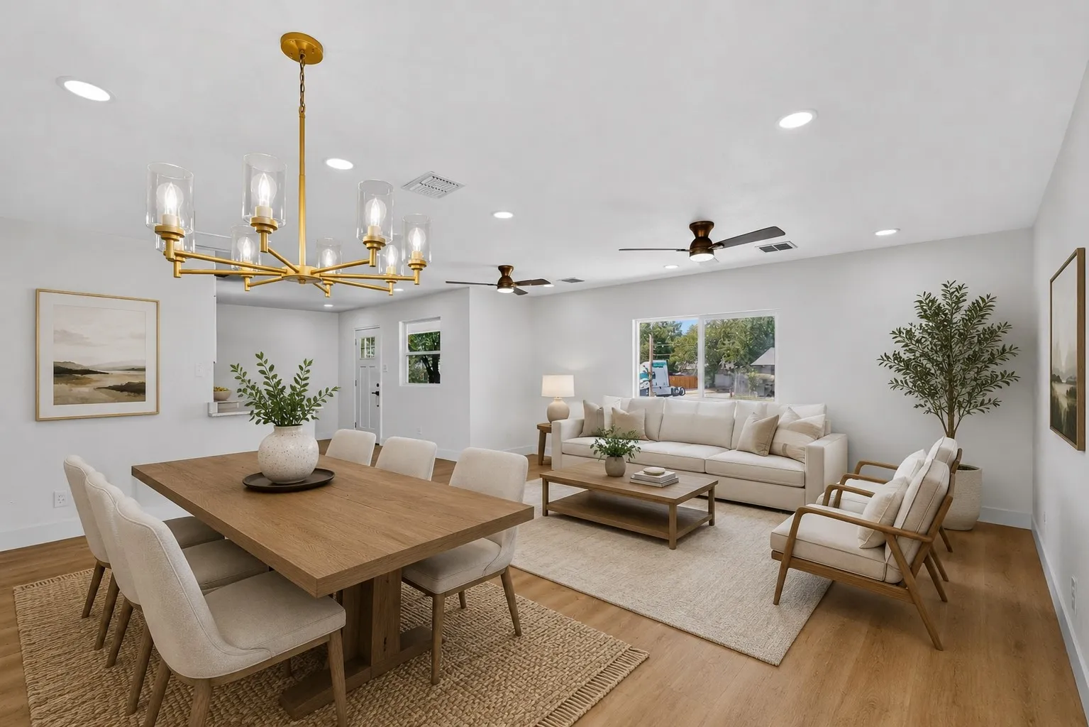 Virtually staged wood-finish flooring, recessed lighting, and ceiling fans