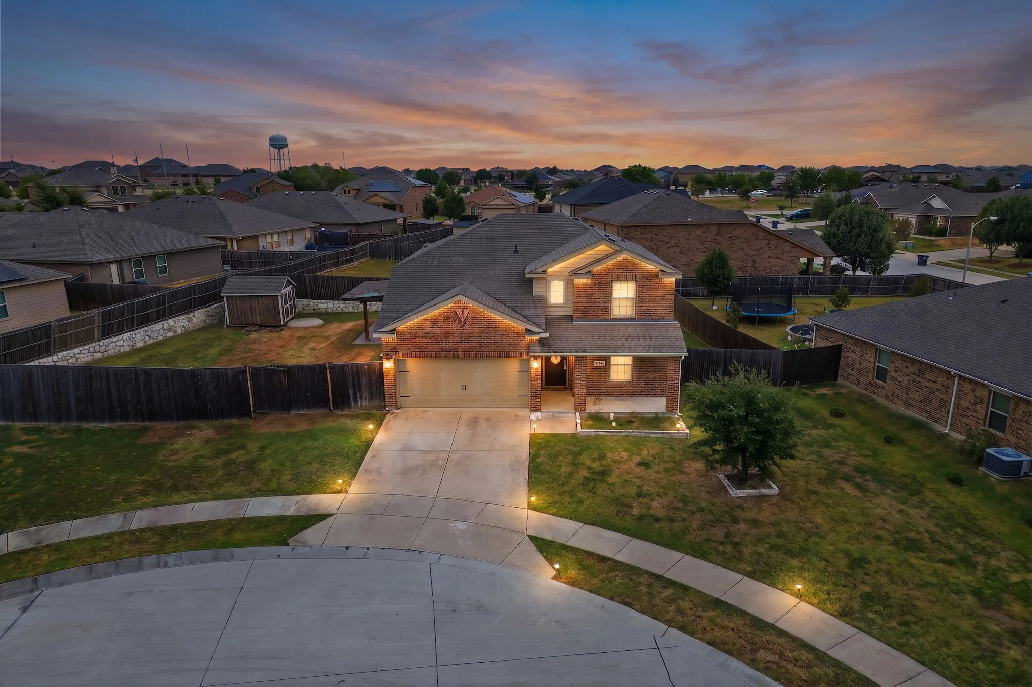 Two-story brick exterior with an attached garage