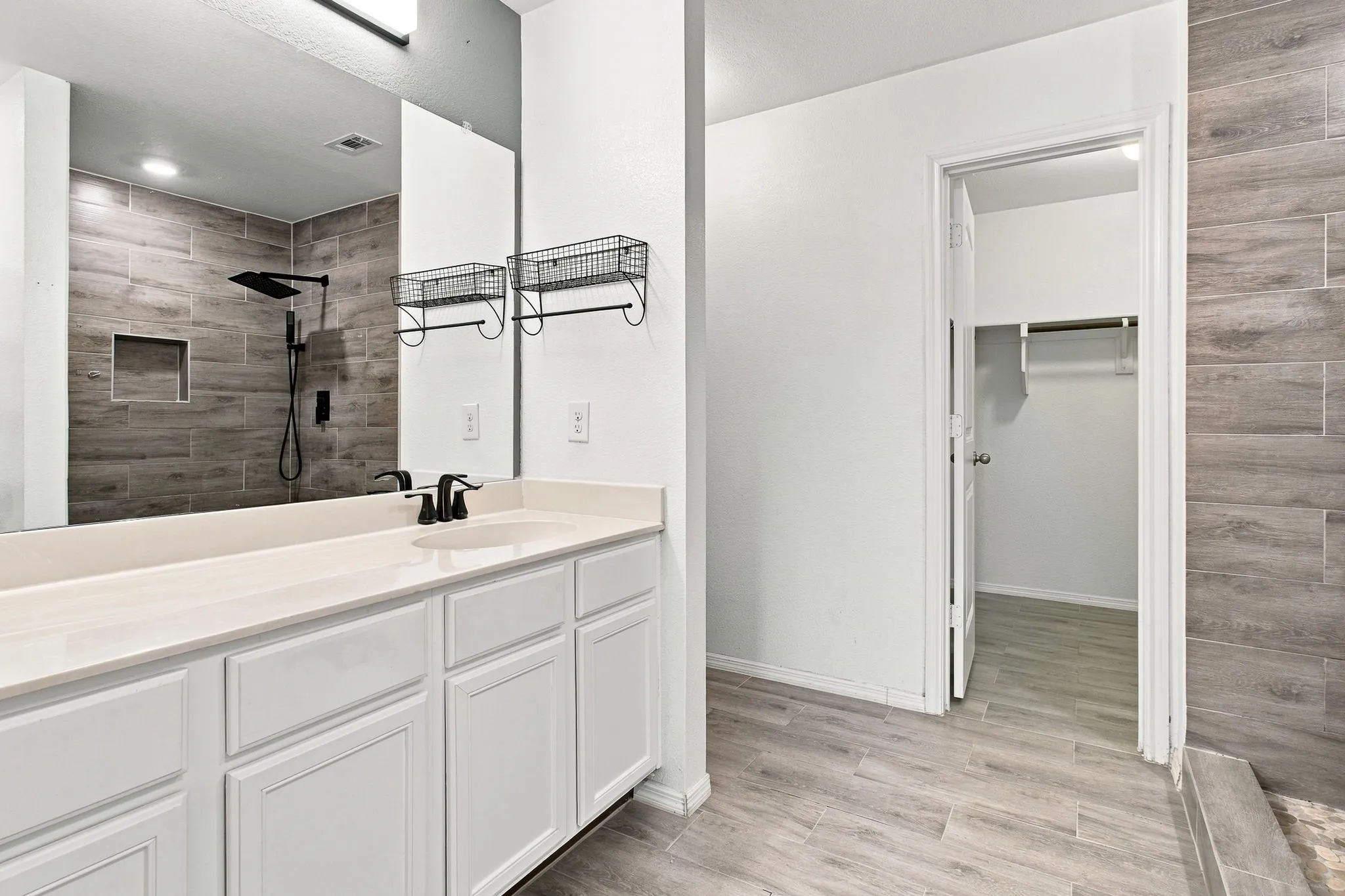 White vanity with a light-toned countertop