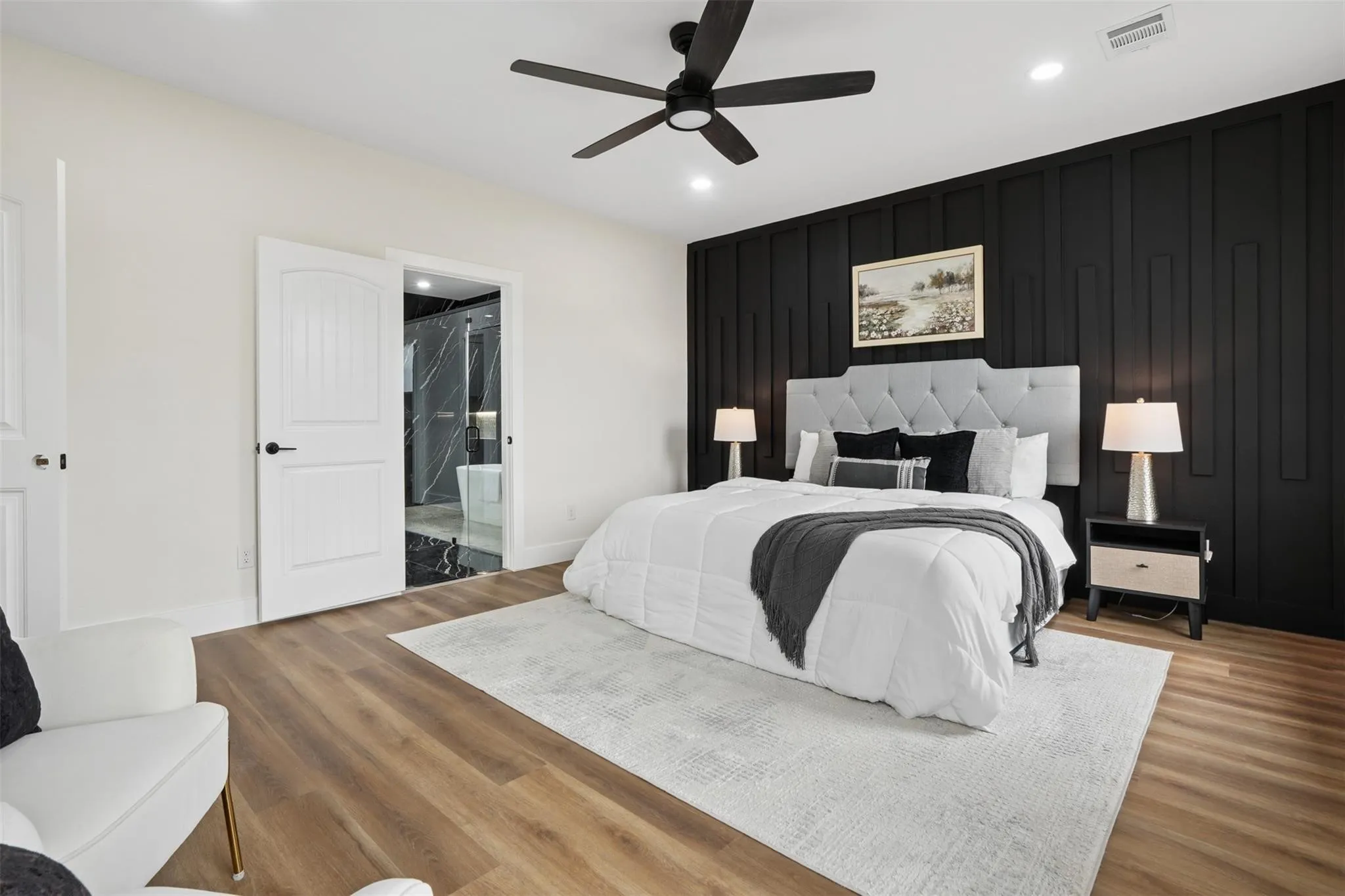 Accent wall with vertical paneling, wood-finish flooring, recessed lighting, and ceiling fan