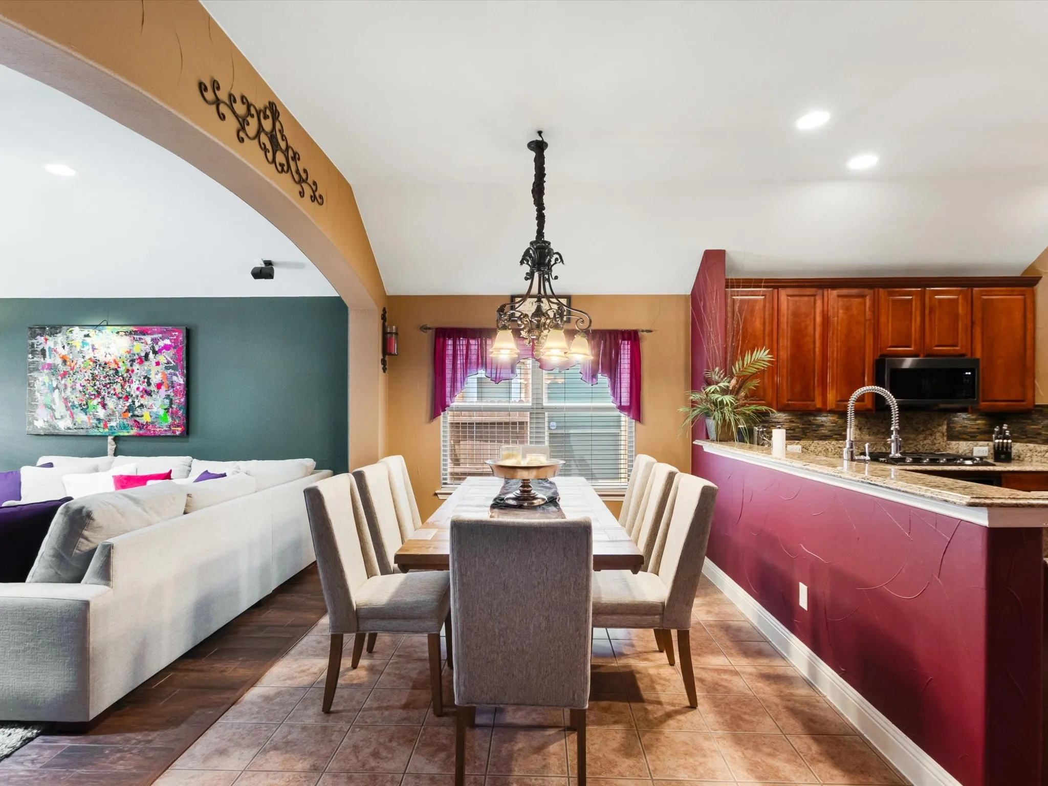 Kitchen featuring wood cabinetry, an undermount sink, and a built-in microwave