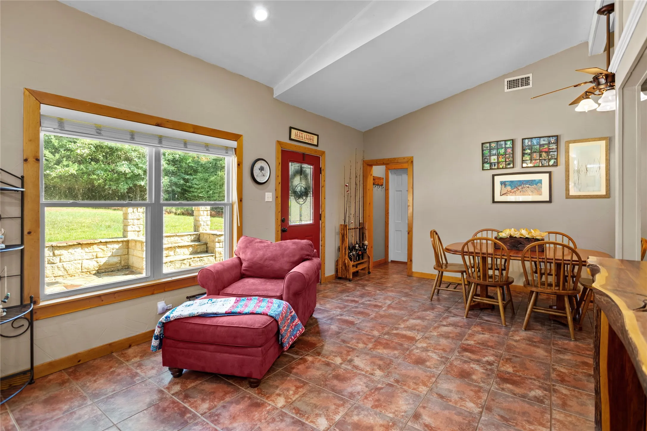 Living area featuring lofted ceiling, ceiling fan, and recessed lighting