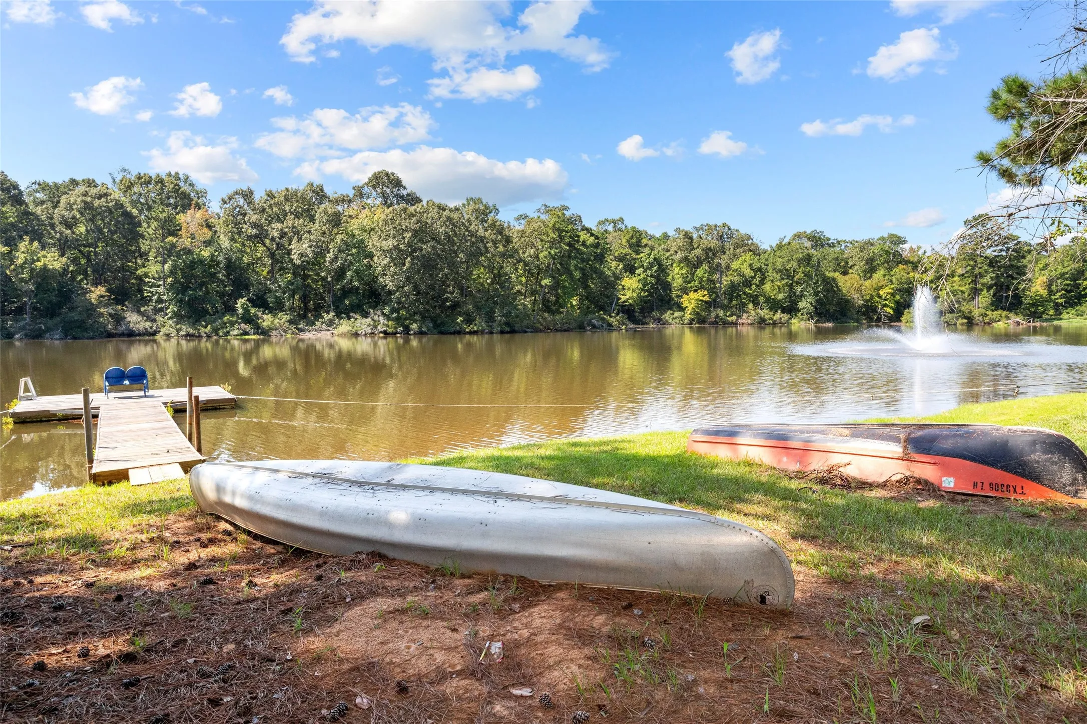 Water view with a floating dock
