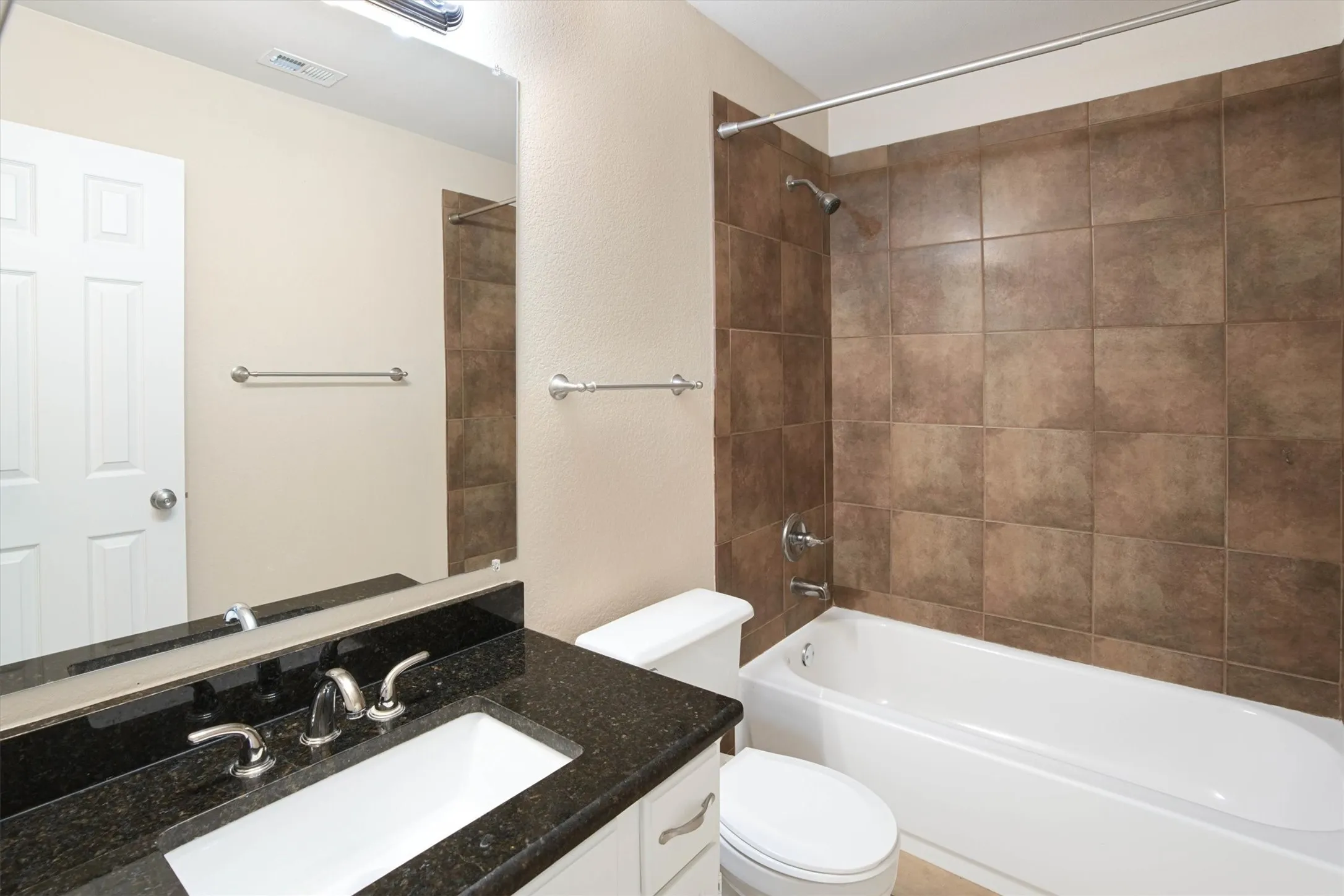 Hall bathroom conveniently located by the secondary bedrooms
