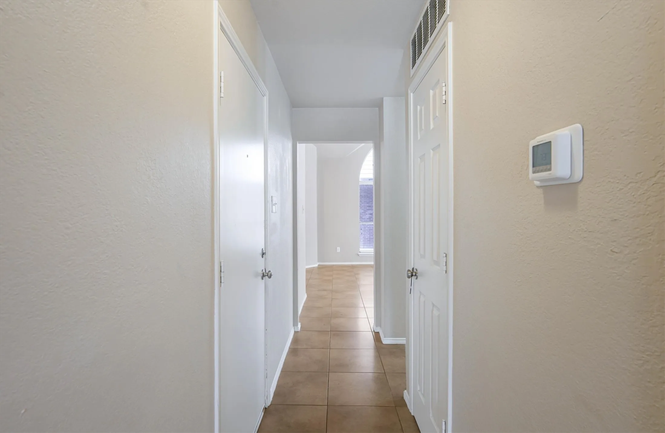 Utility closet conveniently located in hallway between kitchen and bedrooms