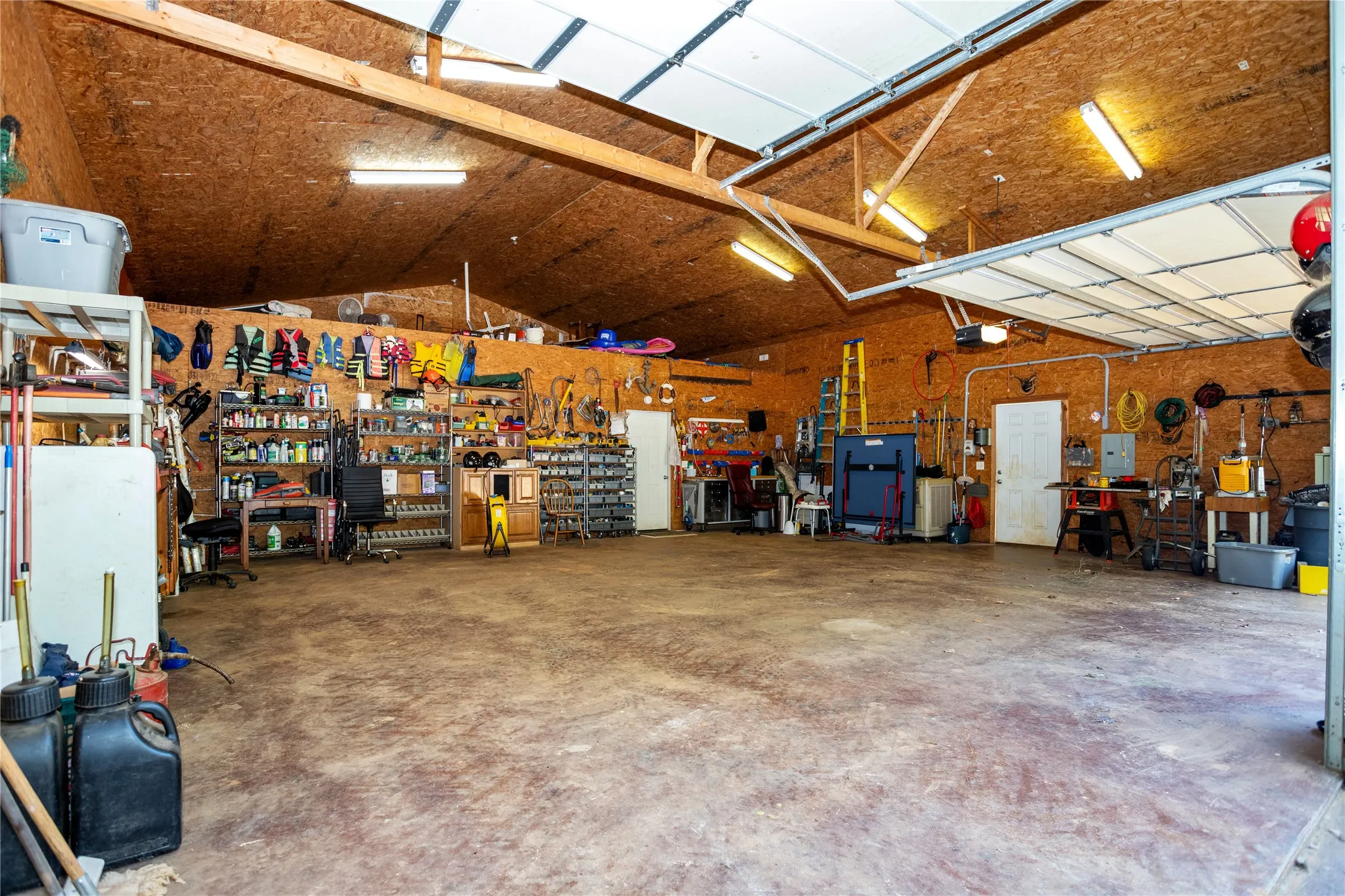 Garage featuring a workshop area