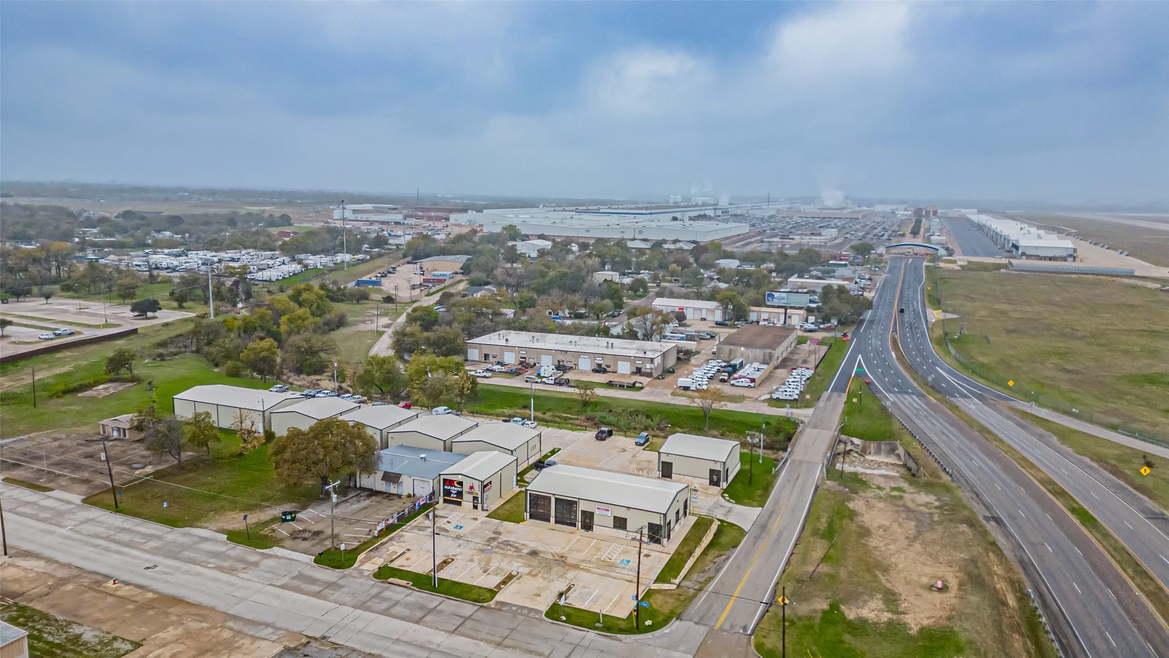 View of property location featuring a highway and an industrial area