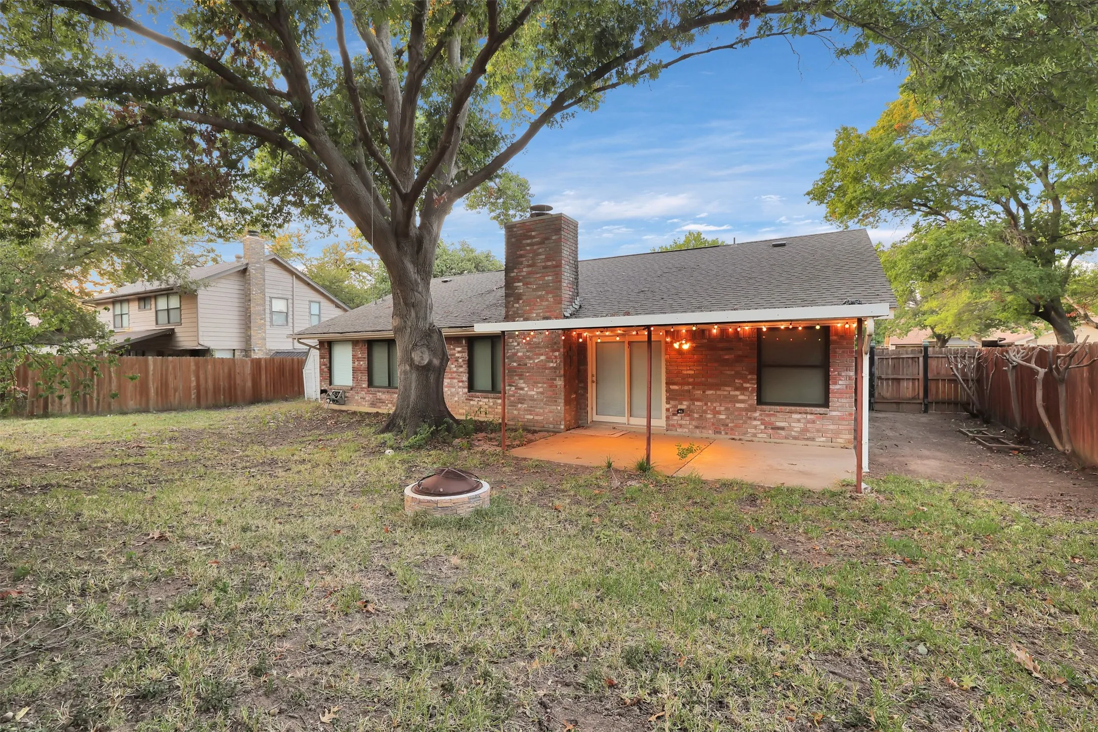 Covered patio and large backyard