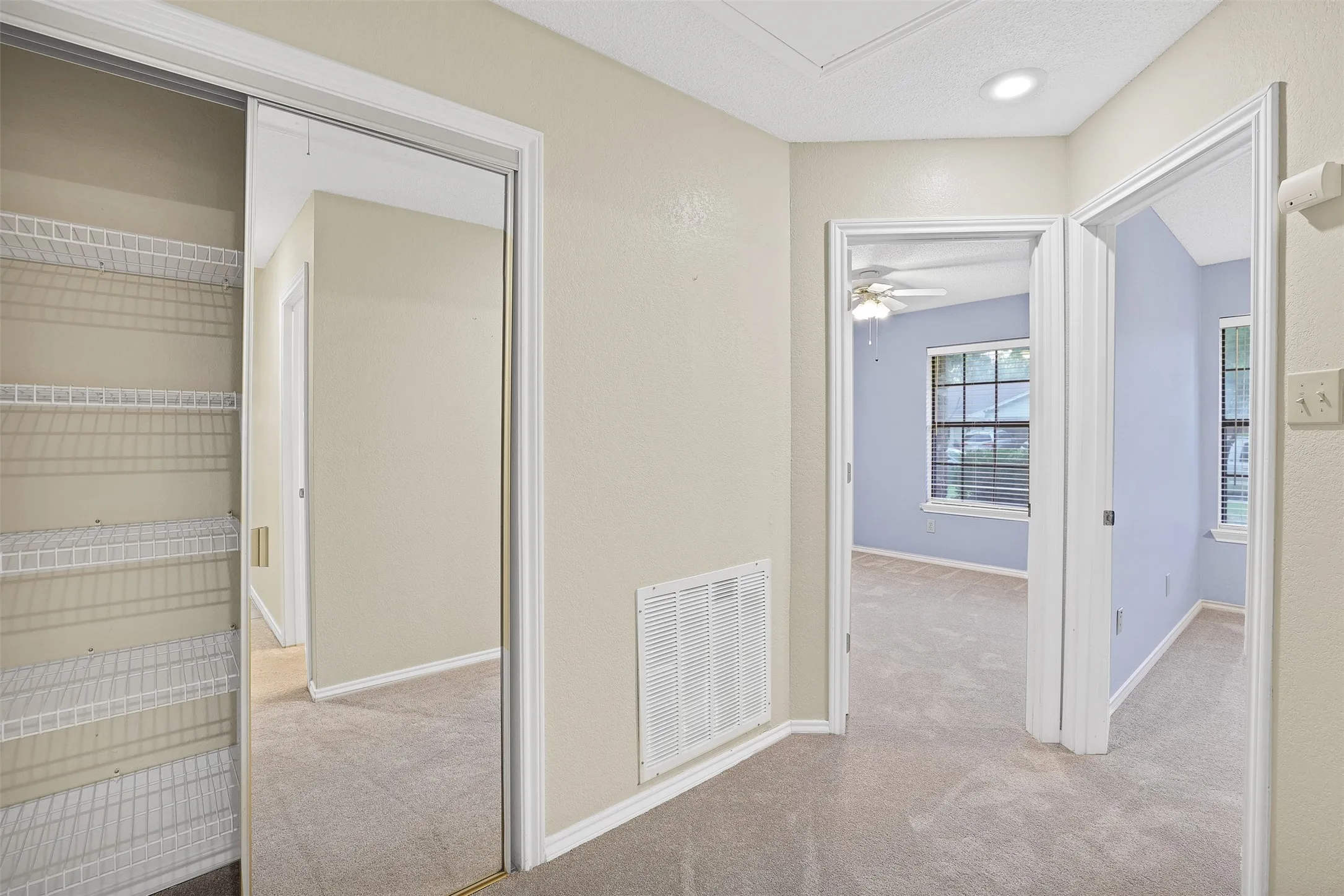 Extra storage closet and leads to 2 bedrooms