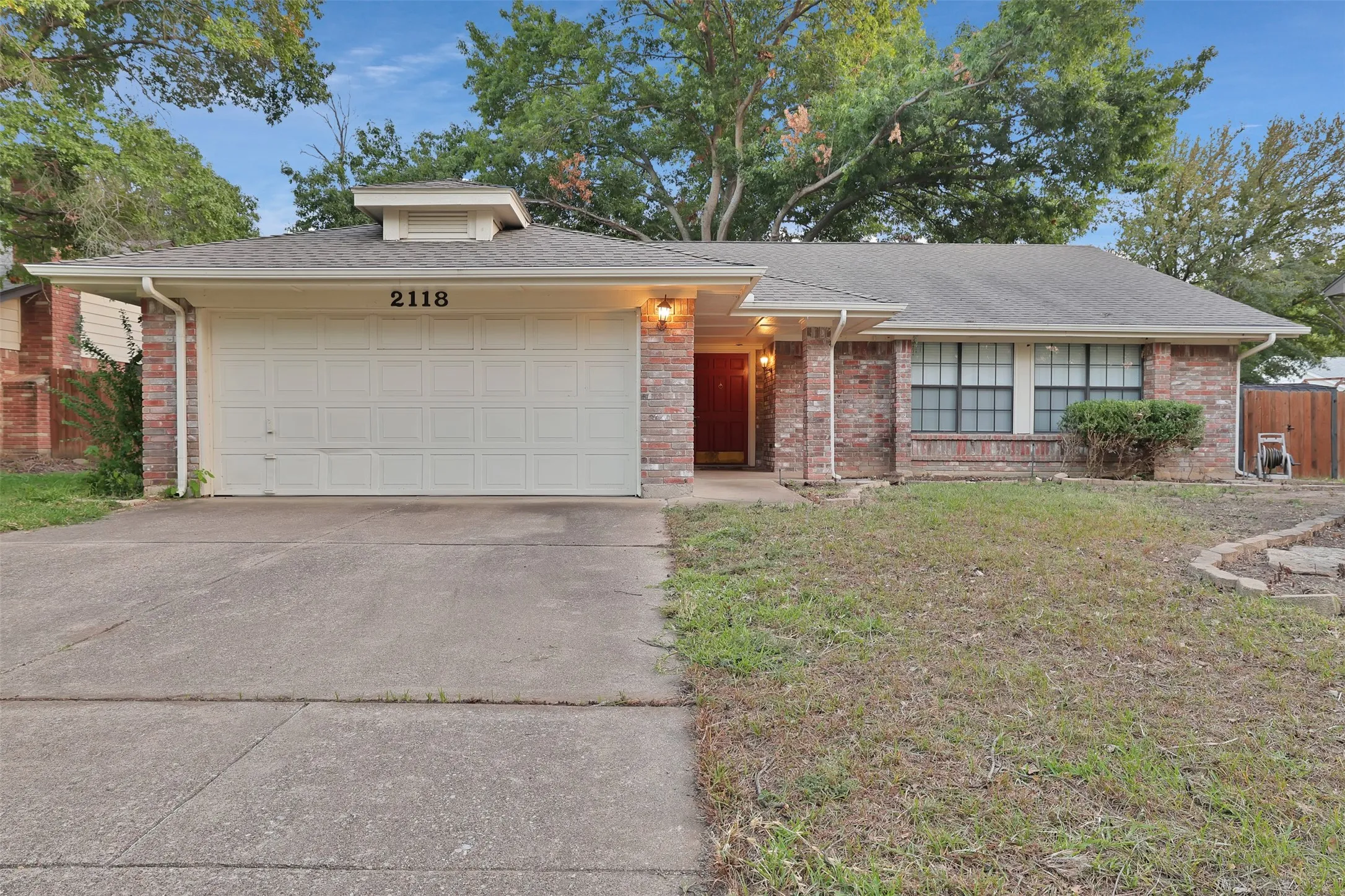 2118 Churchill Downs, front garage with brick home