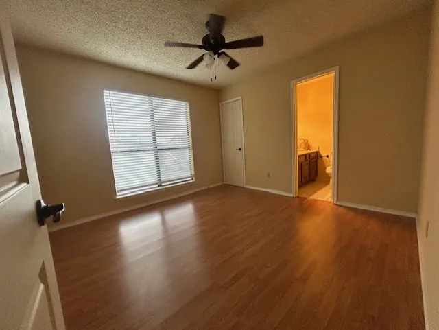 Bedroom 2 with ceiling fan and hard surface flooring