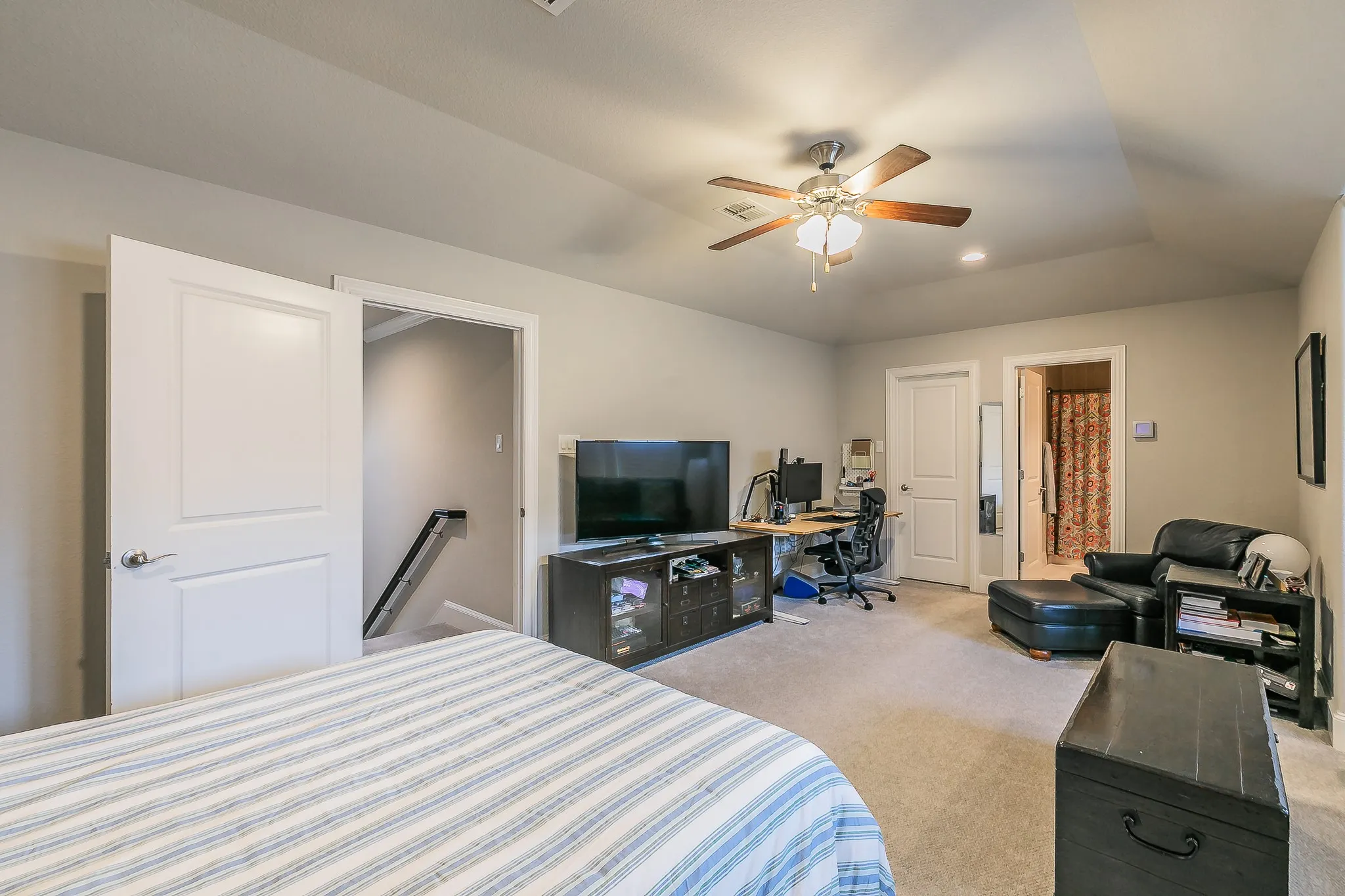 Carpeted flooring, recessed lighting, and a ceiling fan with light fixture