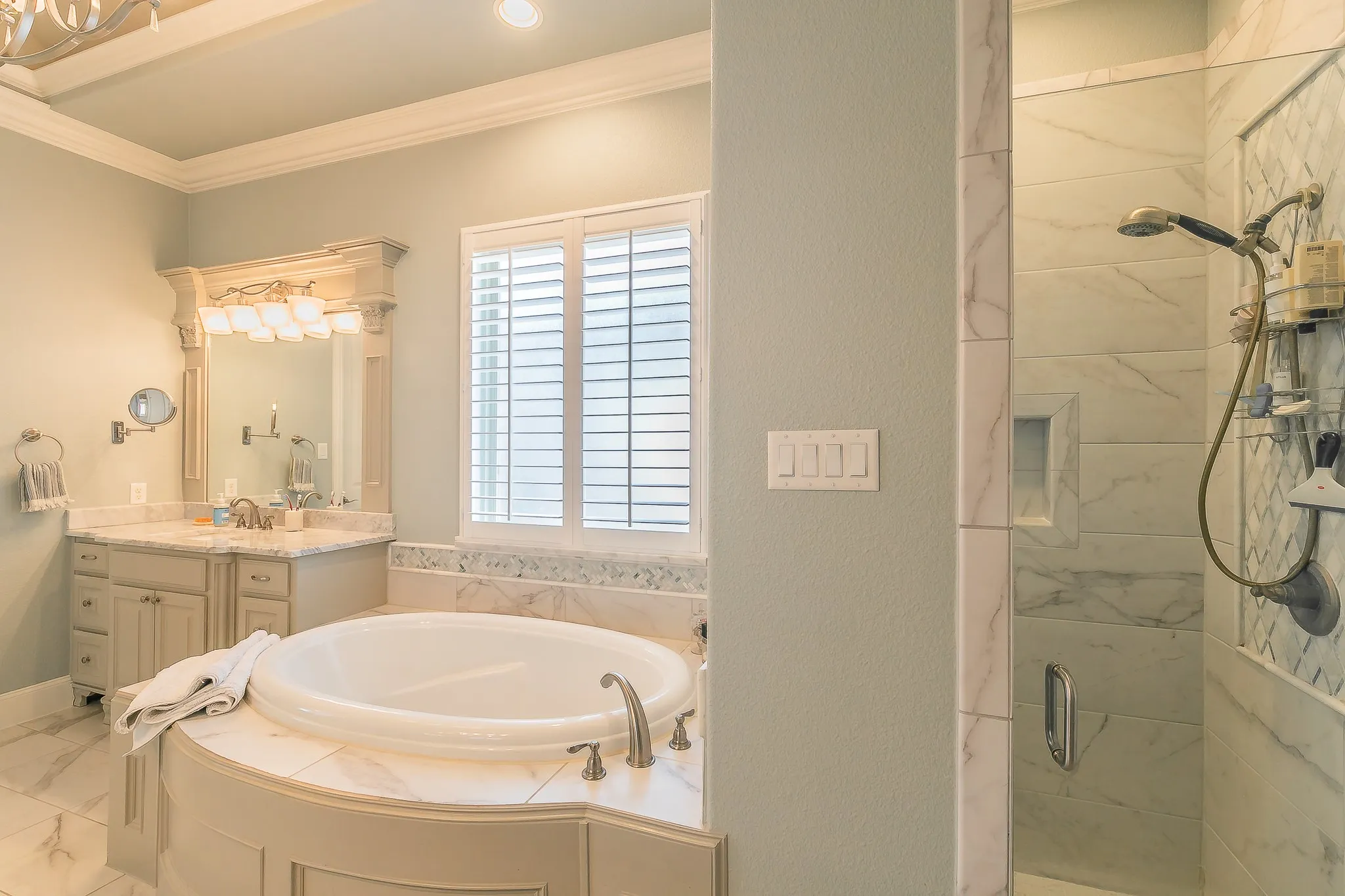 Built-in jetted tub with stone-finish surround