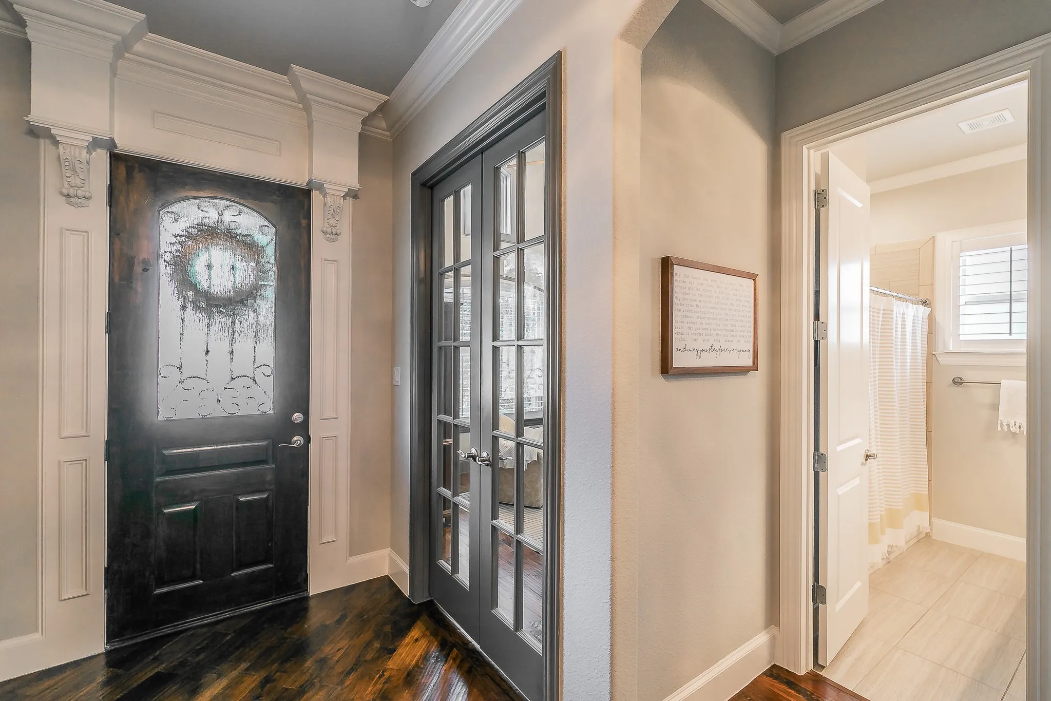 Wood-finish entry door with decorative glass insert