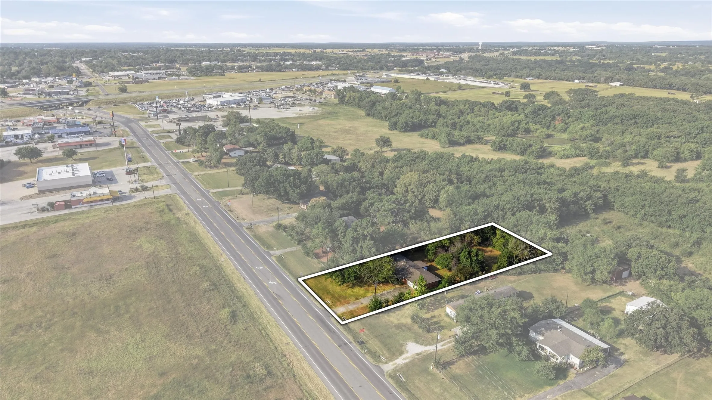 Expansive lot featuring mature trees and clear road access