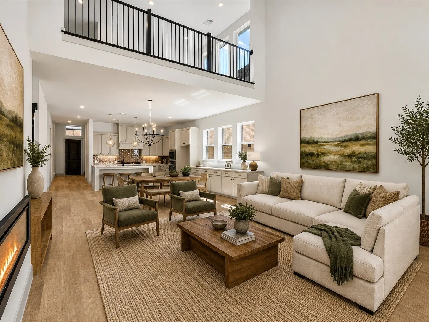 Virtually Staged Living Room for reference - Two-story living area with wood-finish flooring, a linear fireplace, and an open-concept kitchen