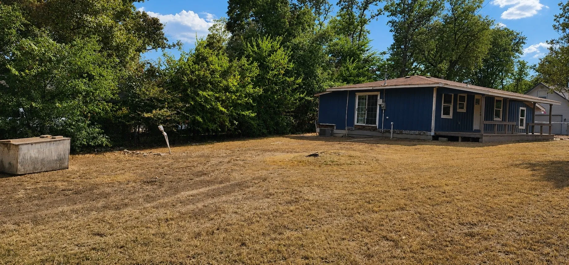 Side yard and irrigation well.