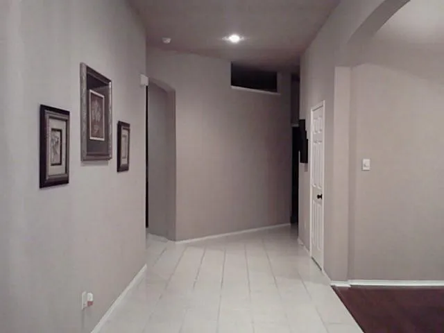 White tile flooring and neutral wall tones
