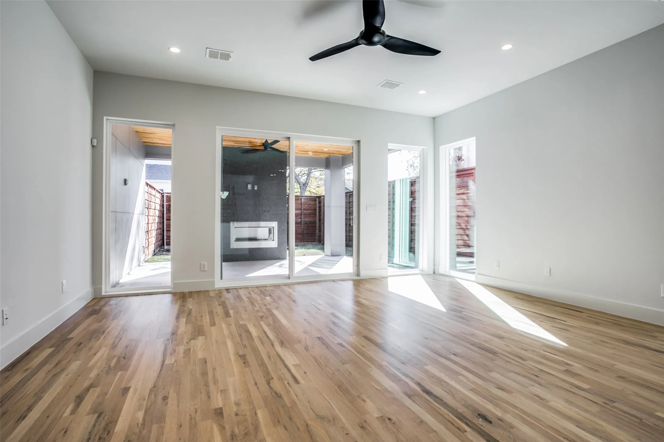 White oak floors enhance this beautiful home and the large covered patio provides a wonderful extension to outdoor living where a beautiful fireplace awaits. Wired for TV too.