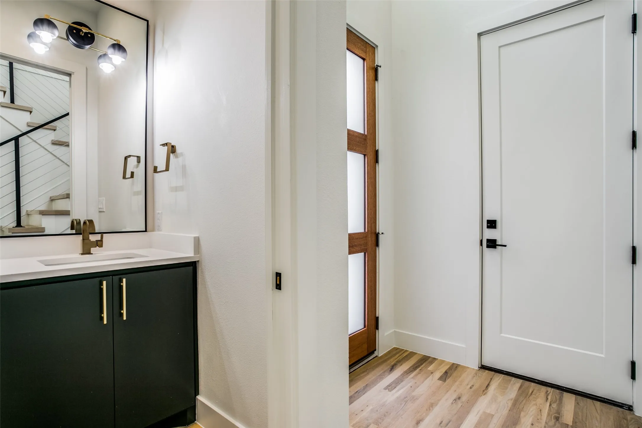 Half bath on first level. Access from garage featured as well.