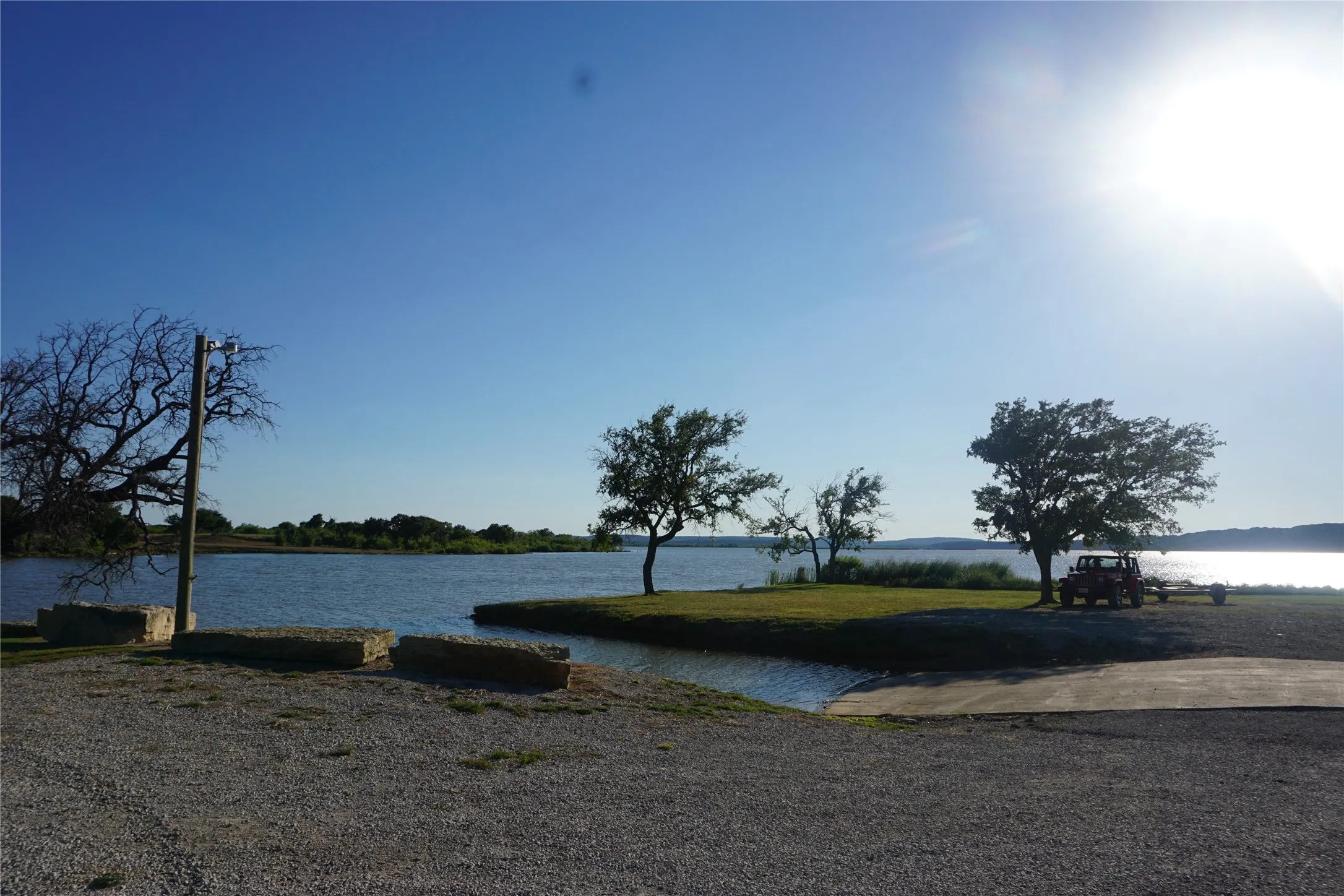 Community watercraft launch area is wide, concreted, and gently sloped for ease of access.