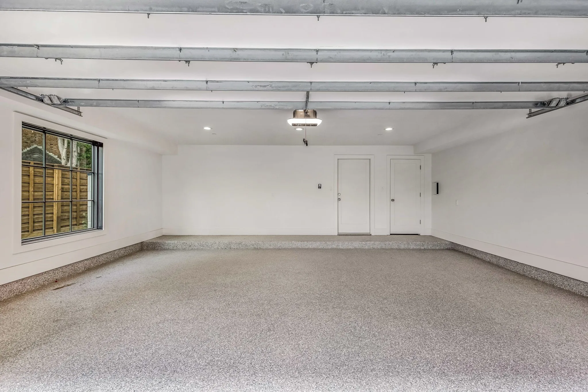 2 car garage with epoxy flooring and electric car charging outlet