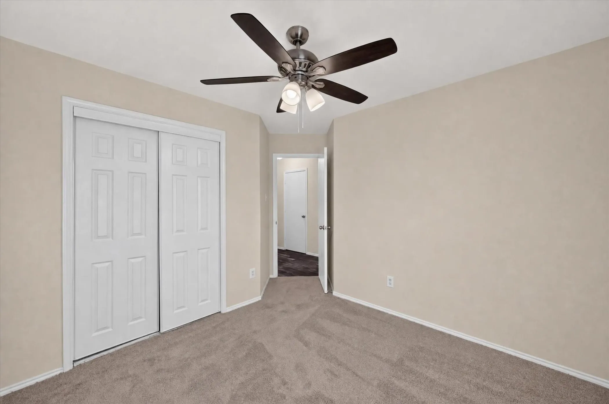 Neutral-toned wall paint with coordinating carpeting