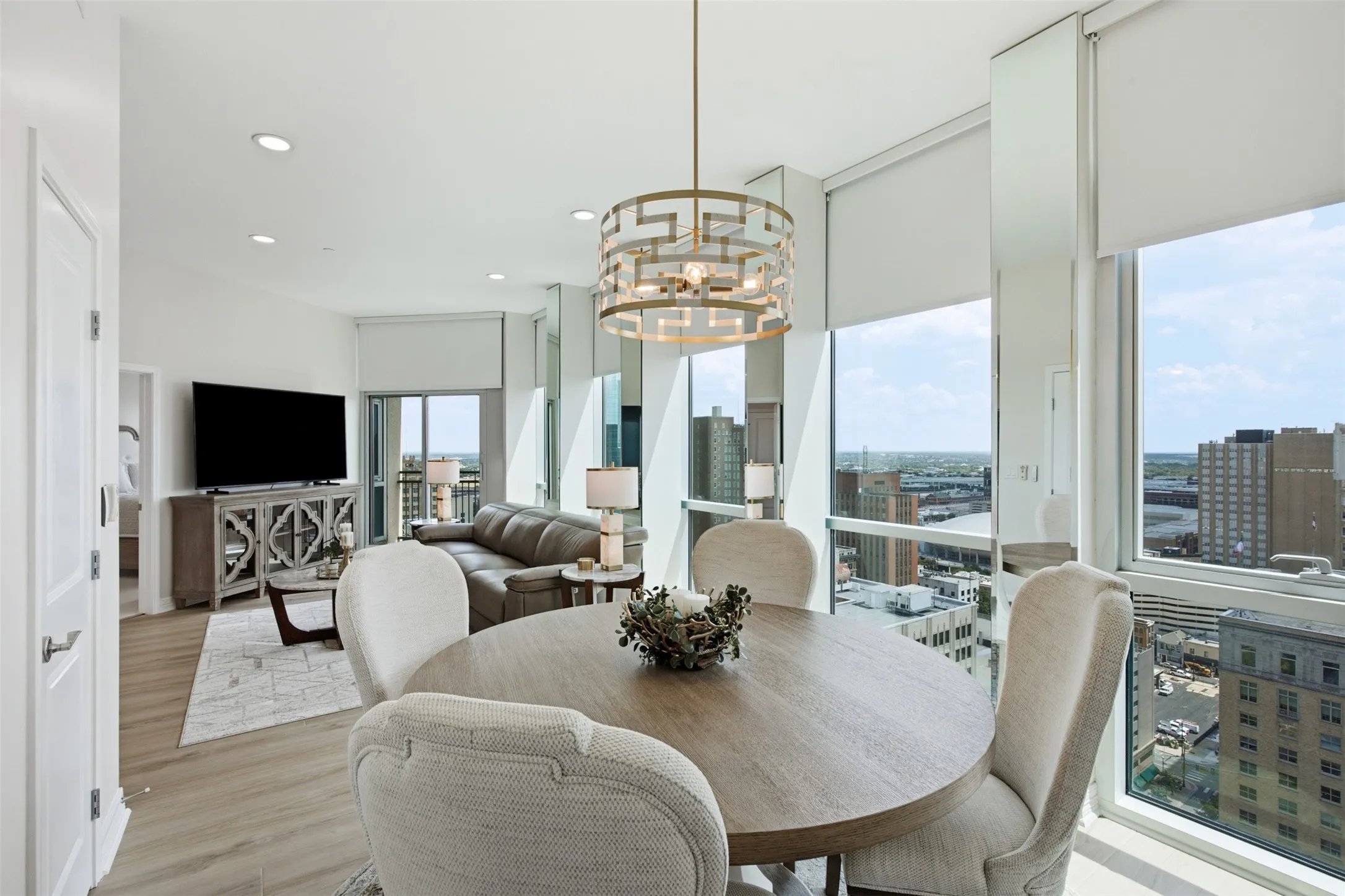Open-concept living and dining area with expansive windows