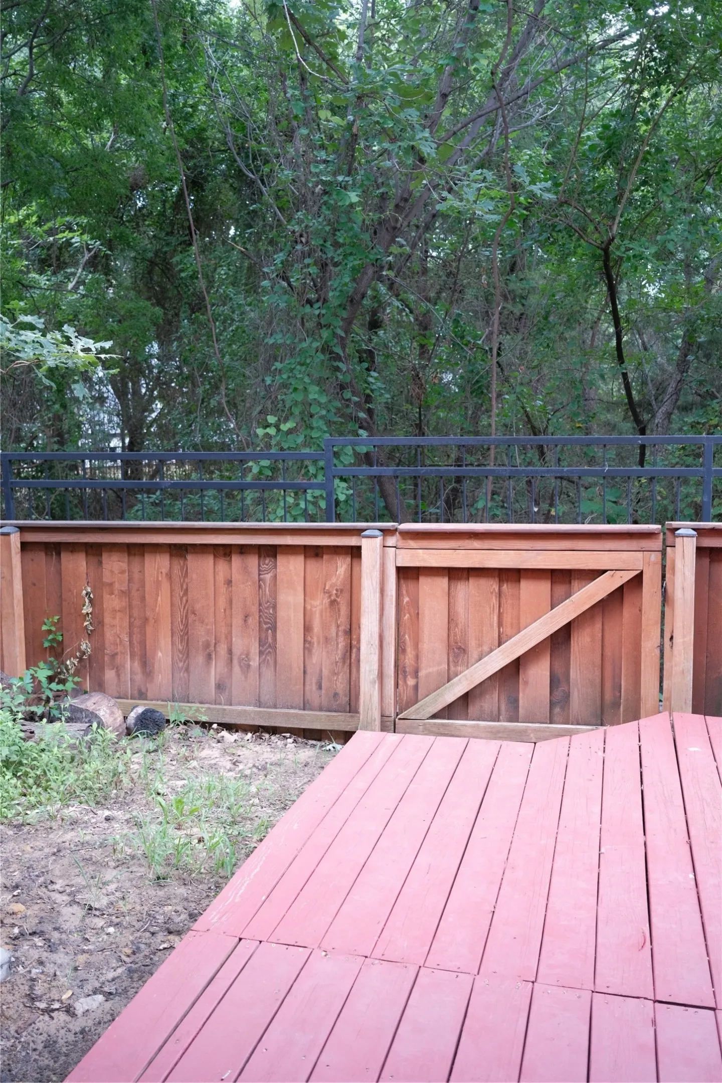 Wood privacy fence with metal railing