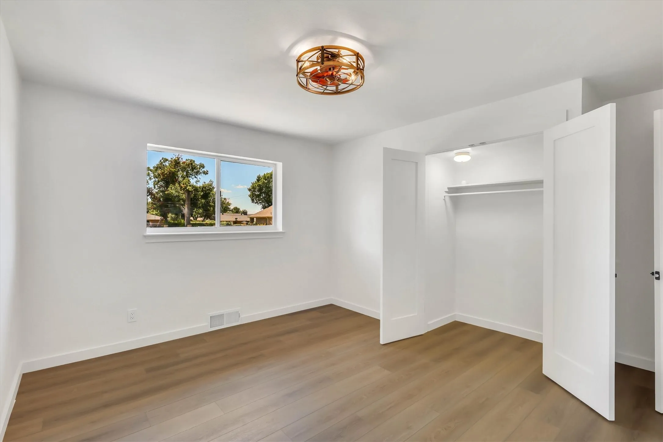 White walls with wood-finish flooring