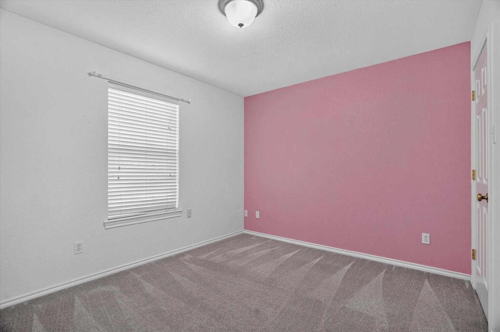 Gray carpeted flooring with white trim