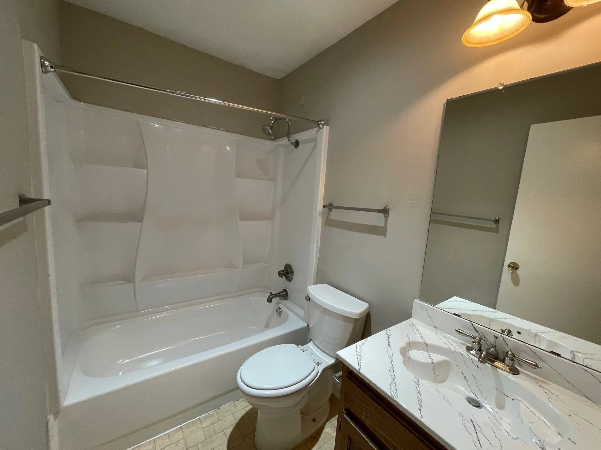 Bathroom with tub / shower combination and vanity