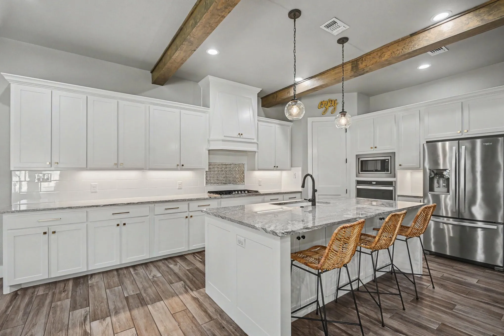 Chef's kitchen with island and bar seating