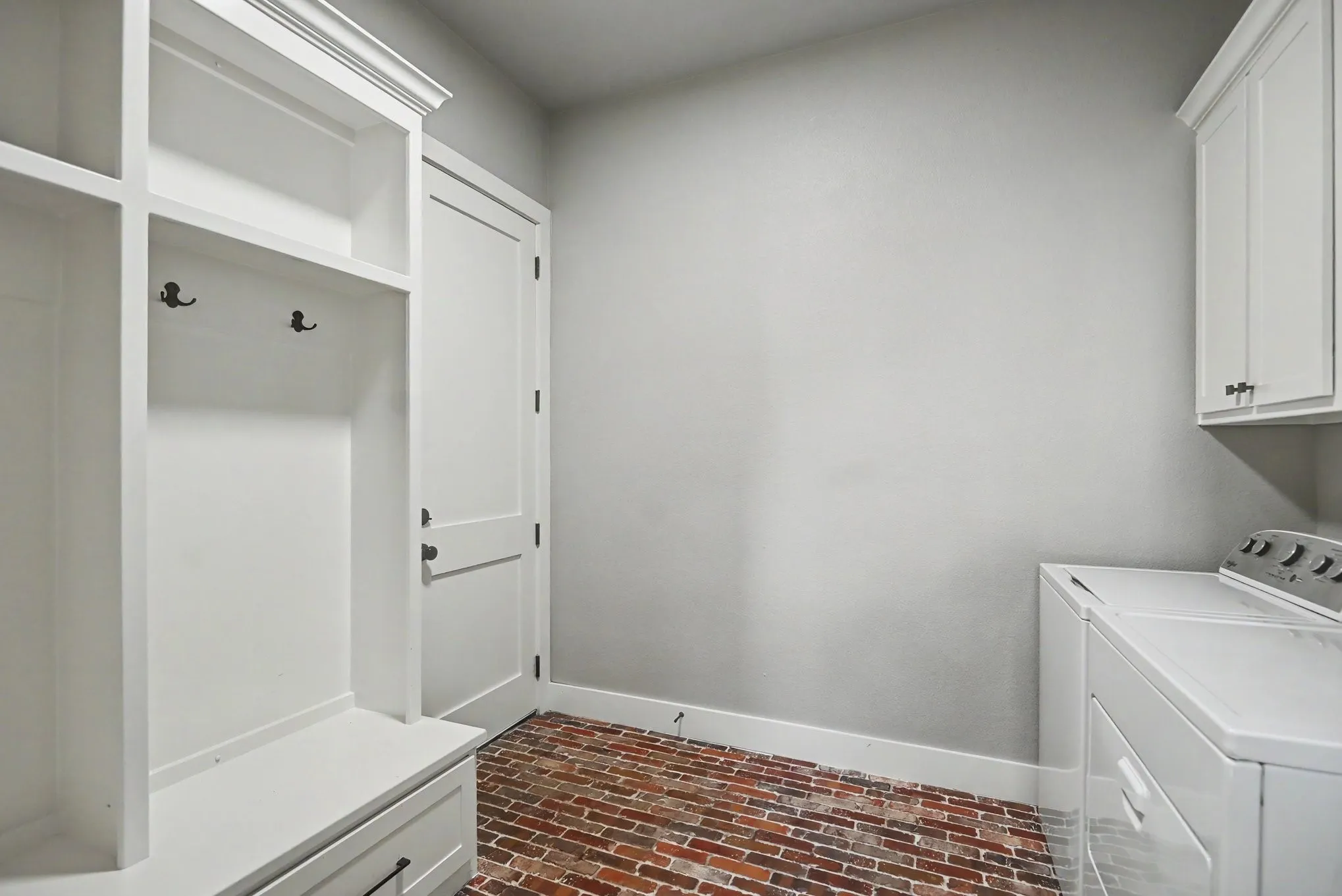 Laundry with mud room/landing space