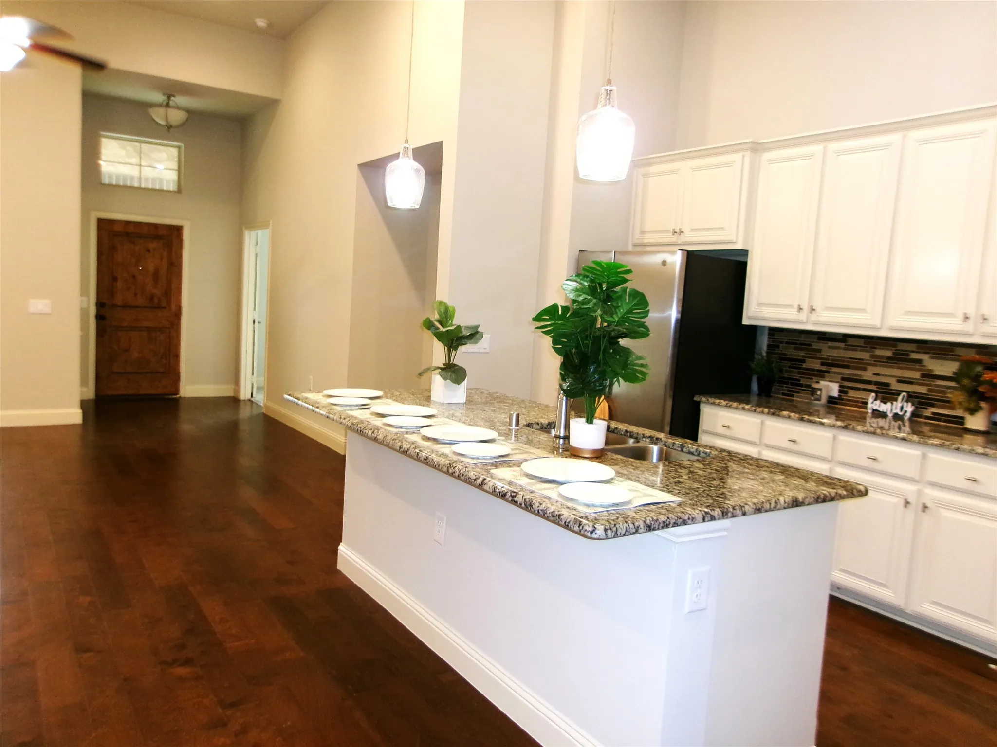 View of kitchen island and house