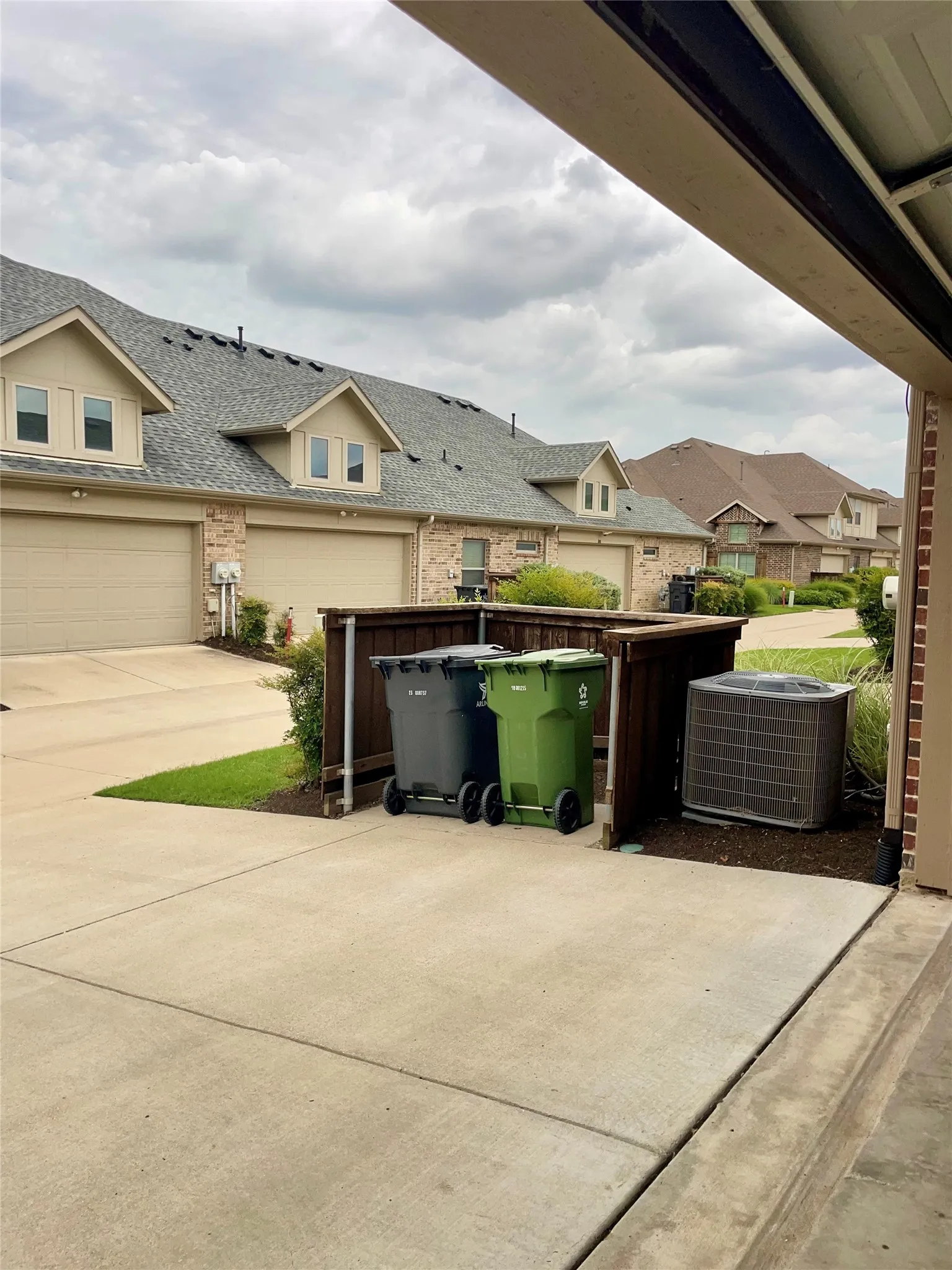 Built-in fenced trash and recycle storage space