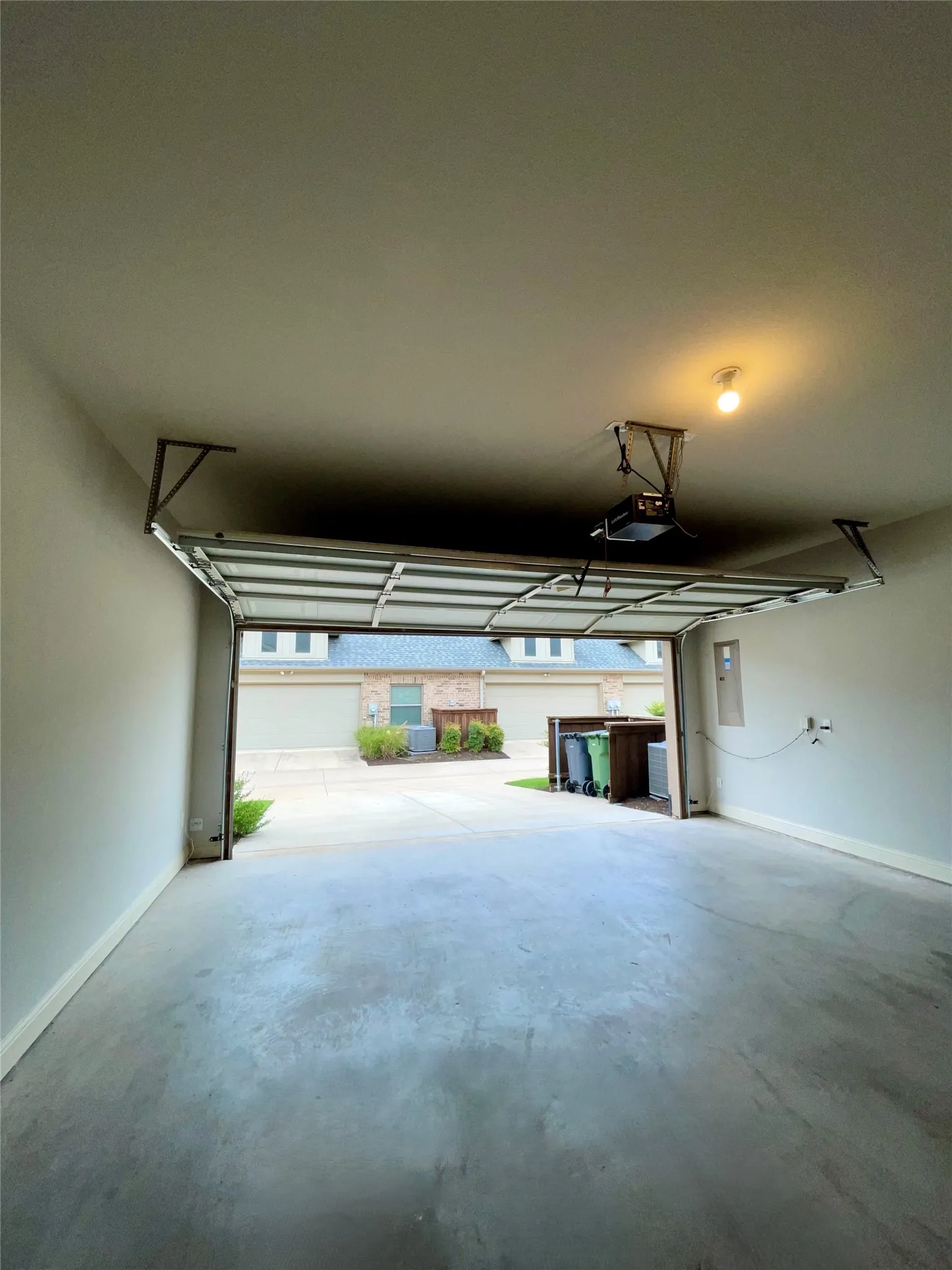 2-car attached garage view with new paint