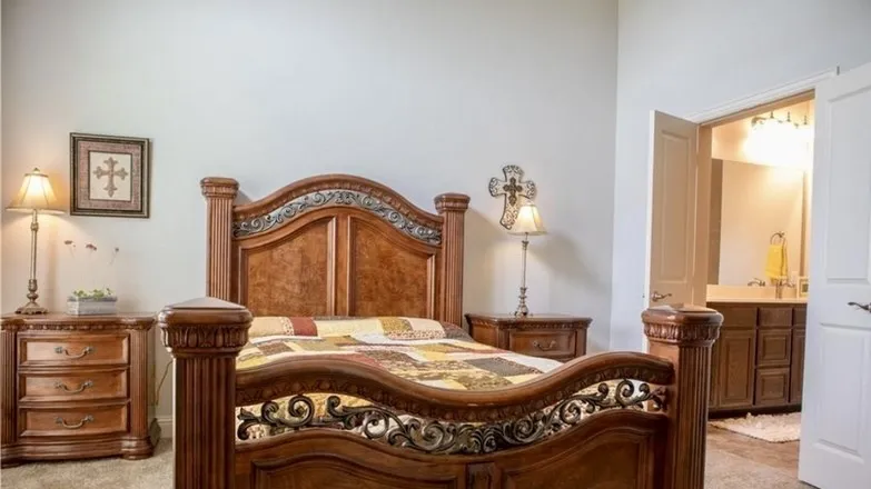Primary bedroom showing king size bed and nightstands