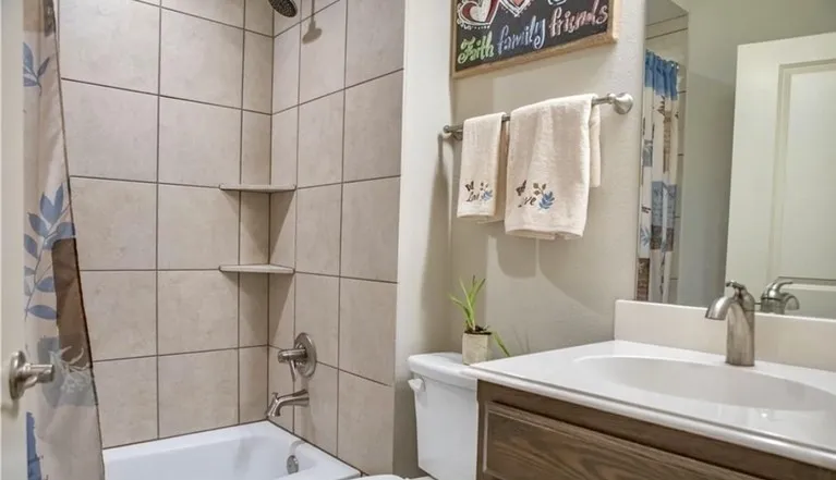 Full bathroom located in hallway