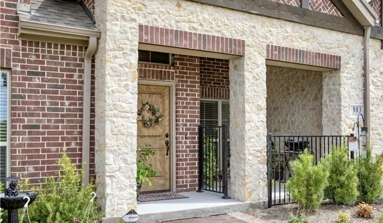 Entry front door and gated porch